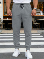 Spring/Autumn High-Quality Men's Sport Pants with Drawstring Cuffs and Zippered Pockets - Solid Color Elasticated Casual Pants